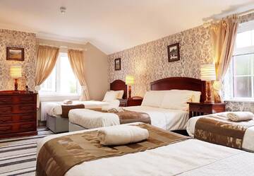 Фото номера Улучшенный семейный номер Отели типа «постель и завтрак» Killarney Inn г. Килларни 12