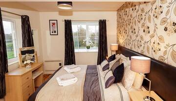 Фото номера Дом с 4 спальнями Дома для отпуска No 1 Killarney Holiday Village Vacation Home г. Килларни 14