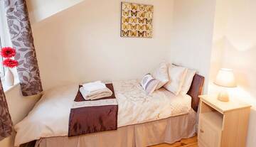 Фото номера Дом с 4 спальнями Дома для отпуска No 1 Killarney Holiday Village Vacation Home г. Килларни 24